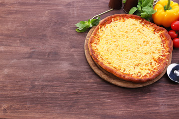 Cheese pizza with vegetables on table close up