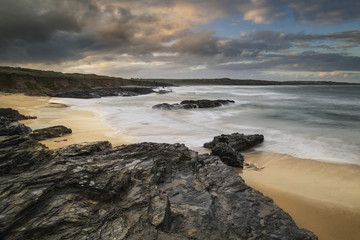 Beautiful sunrise landscape of Godrevy on Cornwall coastline in