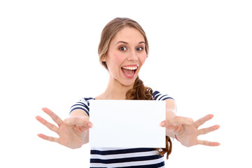 Fototapeta premium Student girl showing white blank sheet - copy space, isolated over background