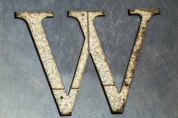letter W cut in the metal sheet