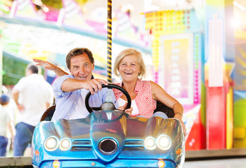 Senior couple at the fun fair