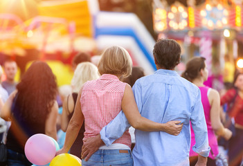 Senior couple at the fun fair