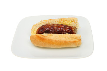 Sausage baguette on plate
