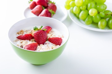 Homemade fruit plate with yogurt, strawberries and granola