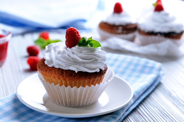 Delicious cupcake with berries on table close up