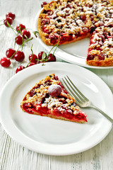 Tasty homemade pie with cherries on table close up