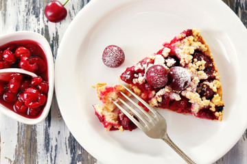Tasty homemade pie with cherries on table close up