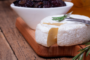 brie cheese on old wooden table