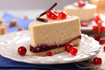 Tasty cheesecake with berries on table close up