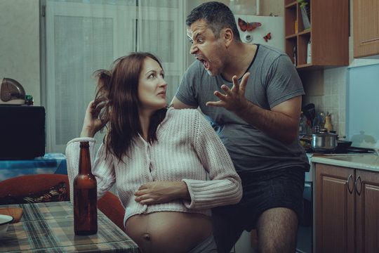 Drunk husband wants to hit his pregnant wife.
