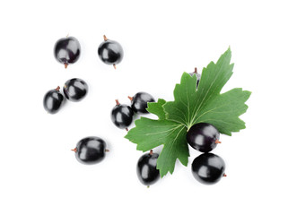 Heap of wild black currant with green leaves isolated on white
