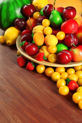 Assorted of fresh fruits on wooden table, closeup