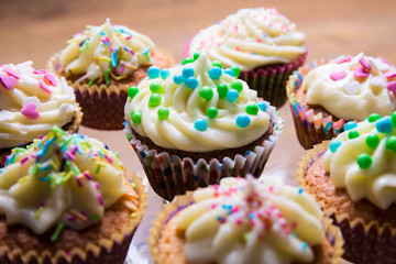 tasty colorful muffins with butter cream