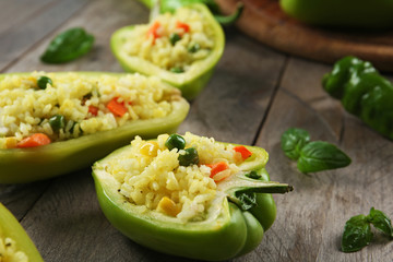 Stuffed peppers with vegetables on table close up