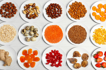 Set of orange products on wooden table, closeup