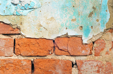 Old brick wall with plaster background