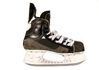 Schilderijen op glas old ice hockey skate close up detail, isolated on white © Crin