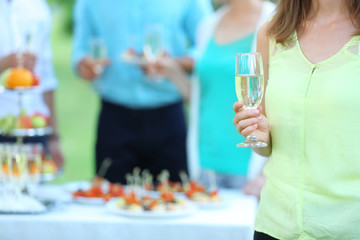 Guests drink champagne on wedding ceremony