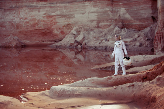 Water on Mars, futuristic astronaut without a helmet in another