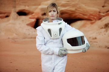 Fototapeta premium futuristic astronaut without a helmet on another planet, image