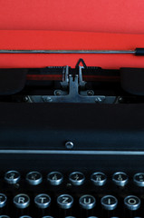 Vintage typewritter with red paper