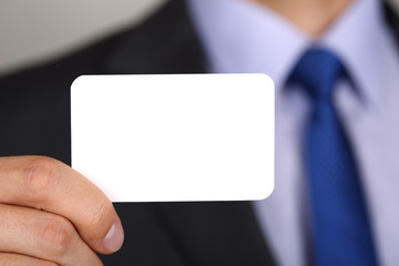 Close up of businessman hand showing business card