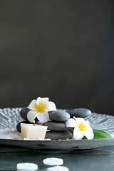 Still life with spa stones on dark background