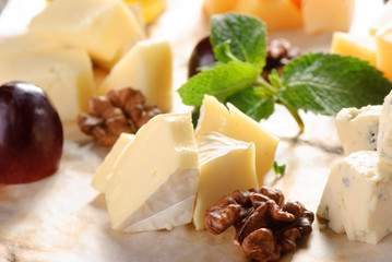 Assorted cheese on a wooden board