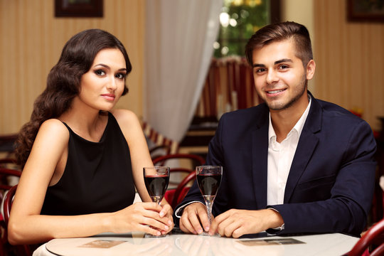 attractive young couple dating at the restaurant