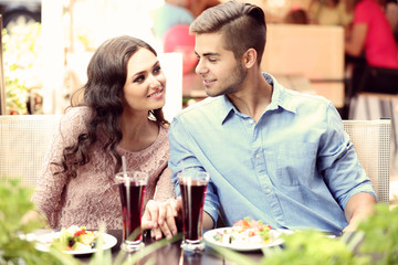 attractive couple have lunch at terrace