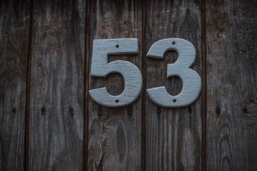 Number 53 on the wooden door