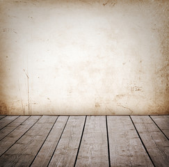 Grunge wall and wood paneled floor, interior of a room.