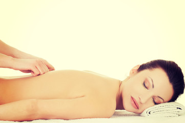 Obraz na płótnie Canvas Woman getting massage in spa