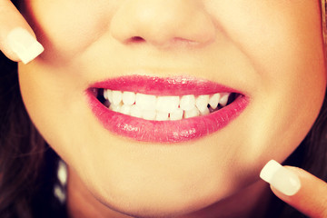 Young woman showing her perfect teeth.