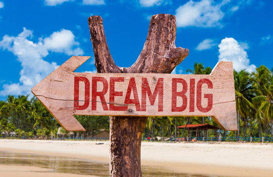 Dream Big arrow with beach background