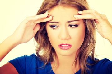 Fototapeta premium Young woman with headache.