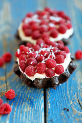 Sweet cake with raspberries on light background