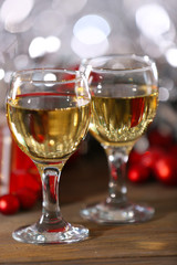 Champagne and Christmas decoration on bright background