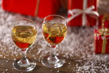 Champagne and Christmas decoration on wooden table