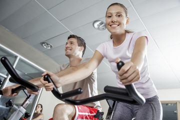 Fototapeta premium smiling woman in cycling class