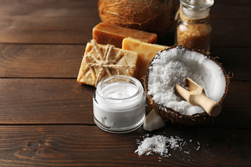 Spa coconut products on dark wooden background