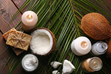 Spa coconut products on dark wooden background