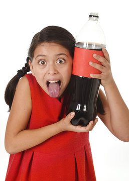 happy female child holding big cola soda bottle against her face in crazy excited expression