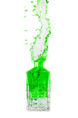 Crystal bottle with liquid splashing out on a white background