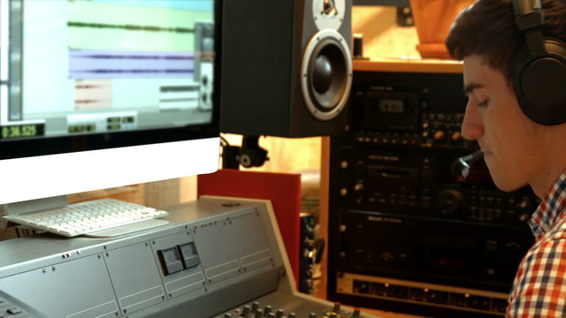Student mixing music in the studio