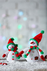 Cute snowmen on Christmas background