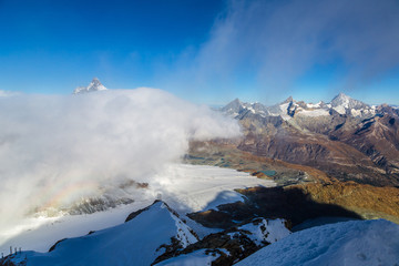 Fototapeta na wymiar Matterhorn peak above clouds
