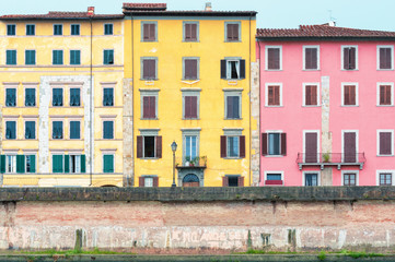 Fototapeta na wymiar Colorful houses in Pisa, Italy.