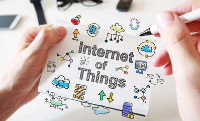 Obraz premium Mans hand drawing Internet Of Things concept on notebook