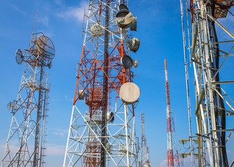 cellular communication towers on blue sky